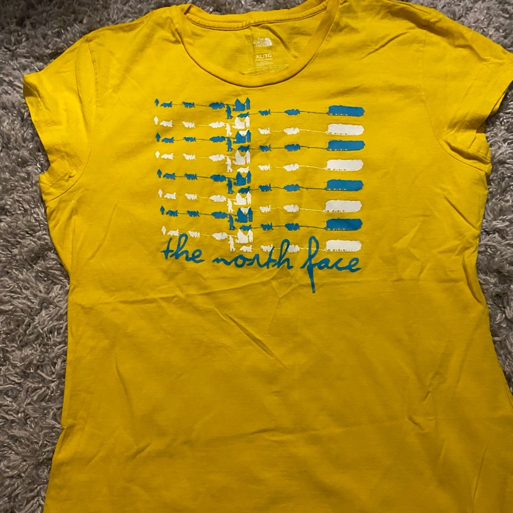 The north face yellow and blue tee shirt
